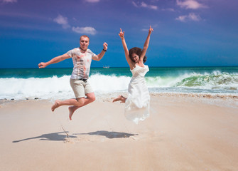 happy couple jumping