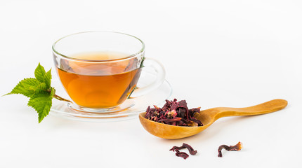 Fresh green, red, black tea leaves in big wooden spoon on white