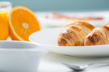 delicious breakfast with croissants and juice