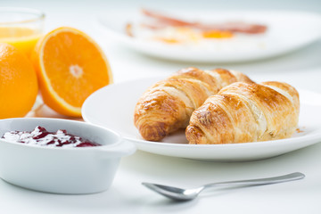 delicious breakfast with croissants and juice