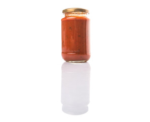 Spaghetti sauce in a jar over white background