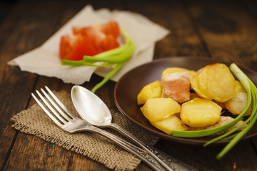 the baked potato with slices of chicken