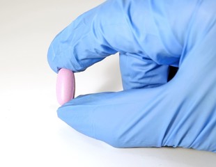 pill and the doctor with the medical glove