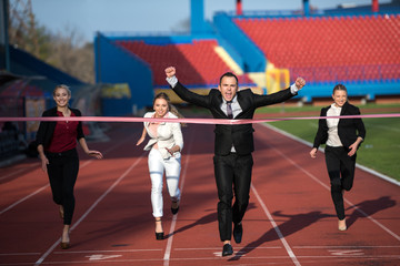 business people running on racing track