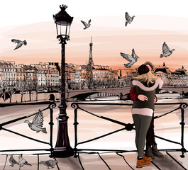 Jeune couple amoureux sur le Pont des arts à Paris