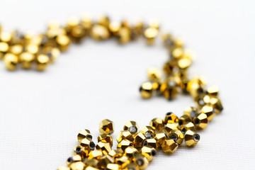 Golden glass beads