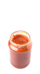 Spaghetti sauce in a jar over white background