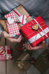A lot of gifts on Valentine's Day in the hands of a girl