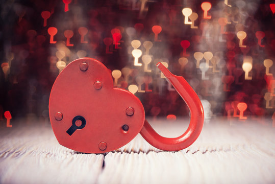 Heart shaped lock over defocused light shaped like keys