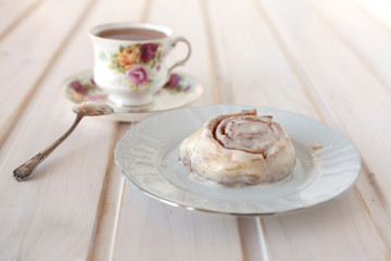 cinnamon roll and tea
