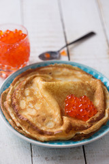 Pancakes with red caviar.