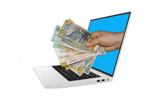Hand holding cash money out of  3D model of laptop computer
