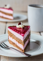 piece of cake with a chocolate biscuit, berry souffle and jelly