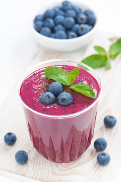 blueberry milkshake with fresh mint and chocolate, vertical
