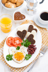 fried eggs in the form of heart for breakfast Valentine's Day