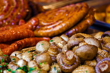 Mushrooms and fried sausages 1
