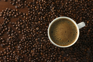 coffee cup with grains on background