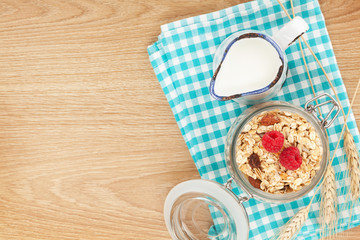 Healty breakfast with muesli, berries and milk