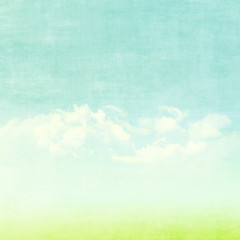 Blue sky, clouds and green field summer background