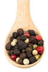 Grains of pepper in a spoon