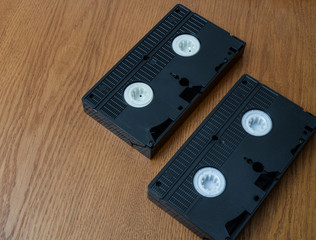 old retro video tape over wooden background