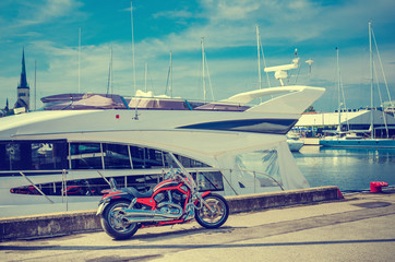 Beautiful bike on the pier on the background of yachts. Cross