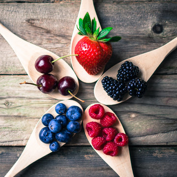 Berries on wooden rustic background