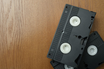 old retro video tape over wooden background