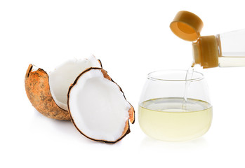 pouring coconut oil isolated on white