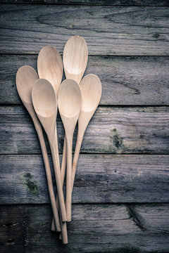Wooden spoons on rustic background