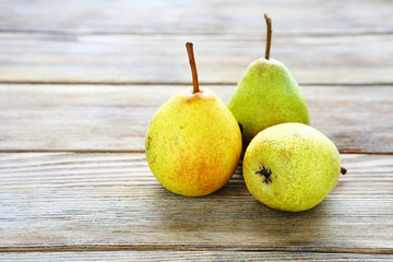 Three ripe pears on the boards