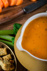 close view on fresh carrot soup with cream