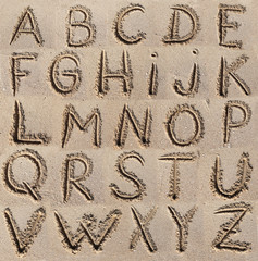 Alphabet (ABC) written on sand.