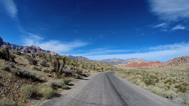 POV Red Rock road trip desert Route 159 blue sky extreme climate Nevada USA