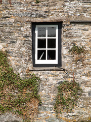 Fototapeta na wymiar Window in an old house in Tintagel, Cornwall