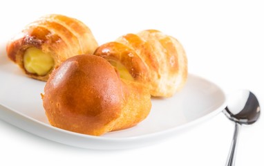 delicious rum babà  near cannoli filled with cream