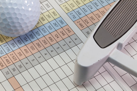 Golf  equipments  lying  on a golf score card