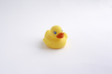 Yellow duck toy isolated on white background