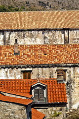 Fototapeta premium Red rooftops of old stone buildings