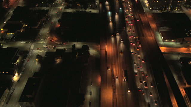Aerial illuminated night view suburban road traffic, USA