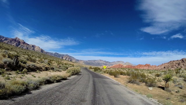 POV road trip desert driving State Route 159 extreme terrain Red Rock Mojave Desert USA