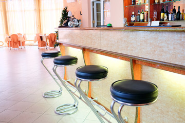 Chairs in row in bar