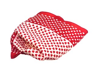 Red and white hearts on a shawl  over white