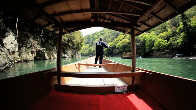 Boatman Katsura River tourist people travel Arashiyama Kyoto Japan 