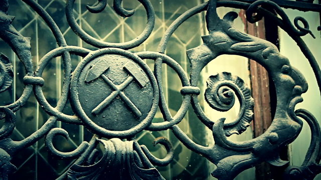 Cinematic shot of iron masonic symbols