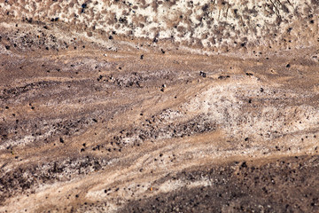 Dark sand surface after the rain