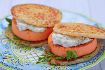 Salmon burger with potato pancakes