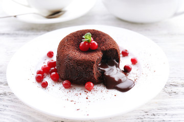 Hot chocolate pudding with fondant centre on plate, close-up