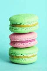 Gentle colorful macaroons on color background