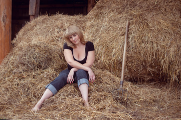Attractive girl in the hay